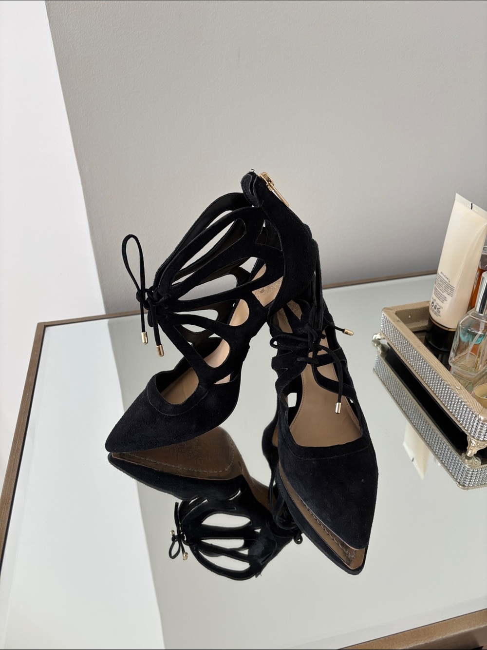 Vince Camuto black suede shoes with gold zipper in the back.